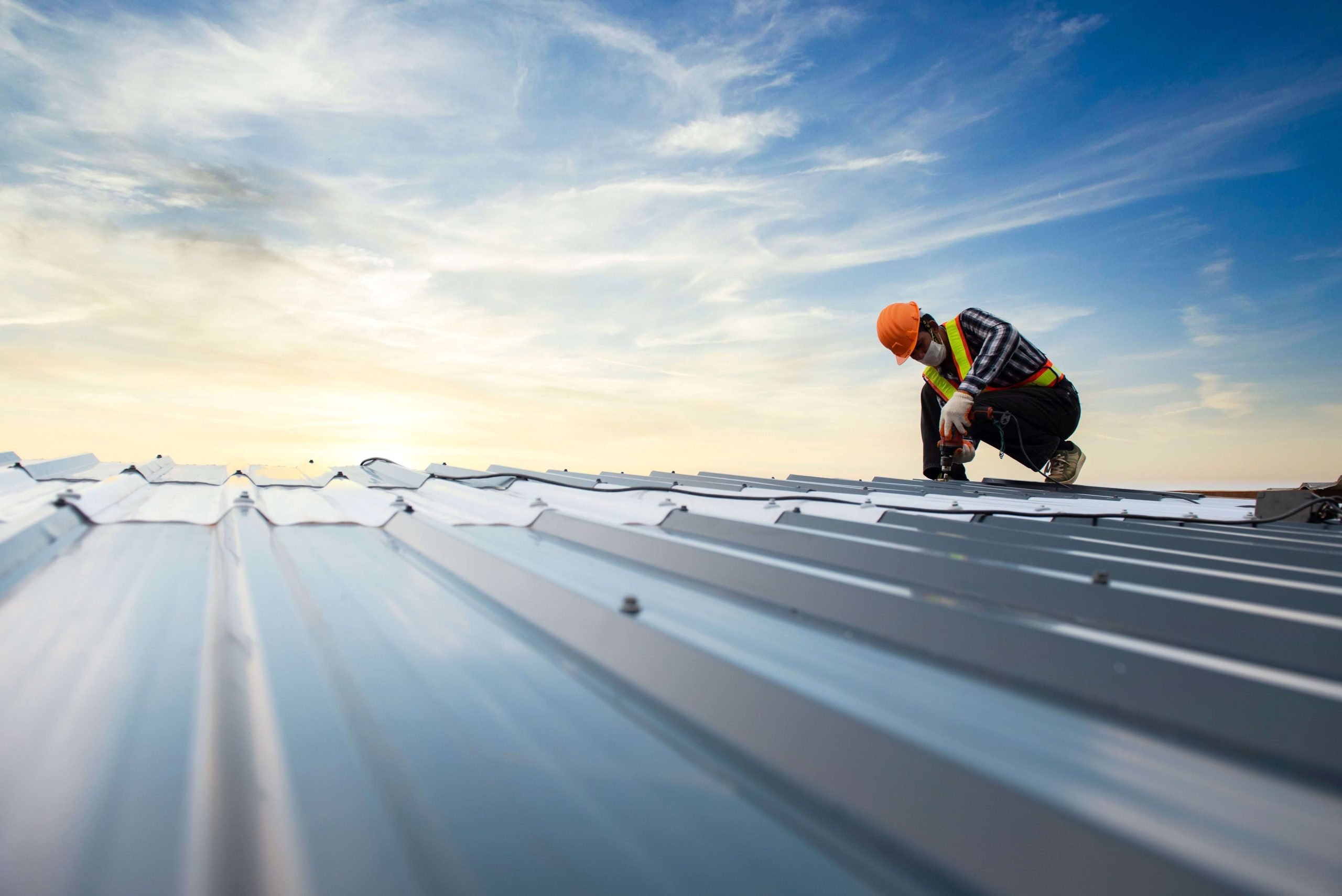 Denver Roofing Contractor Roofing contractor working on a roof in Denver, Colorado