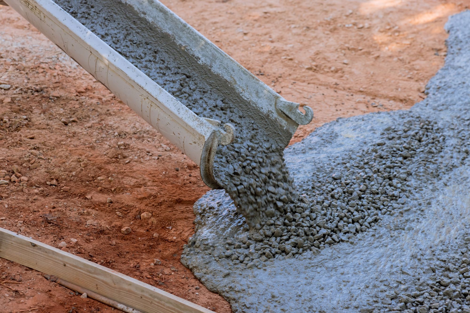 Denver concrete company crew working on a large concrete slab foundation at a commercial site